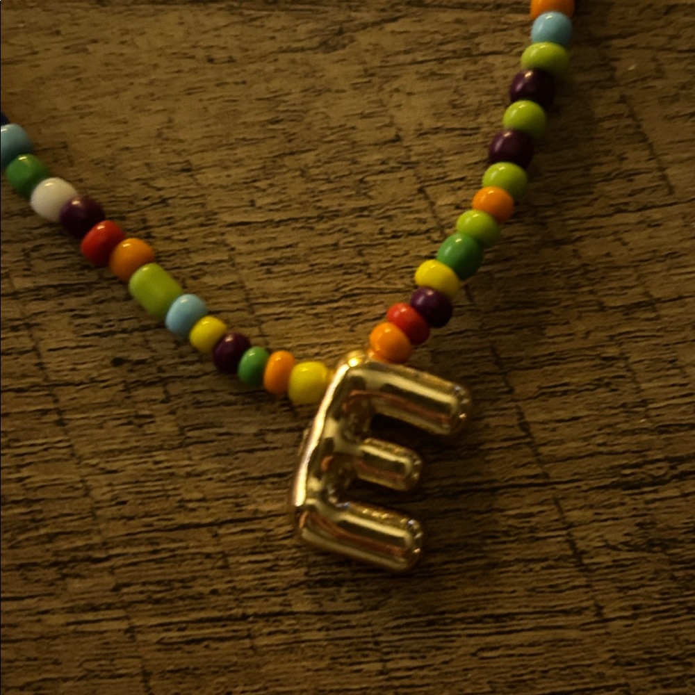 Colorful Beaded Necklace with Gold Tone E Bubble Letter Pendant